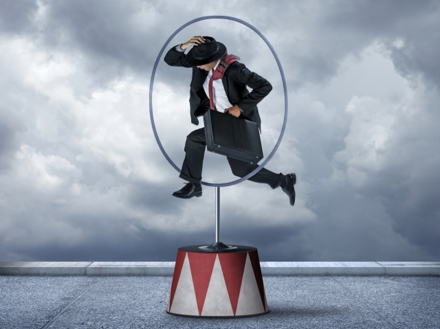 Businessman Jumping Through Hoops 000061948088 Large